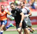 New Zealand's Tim Mikkelson jogs over