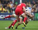 Clermont's Aurelien Rougerie is brought down by the Munster tackler