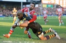 Wasps' Elliot Daly is tackled by Gloucester's Billy Twelvetrees