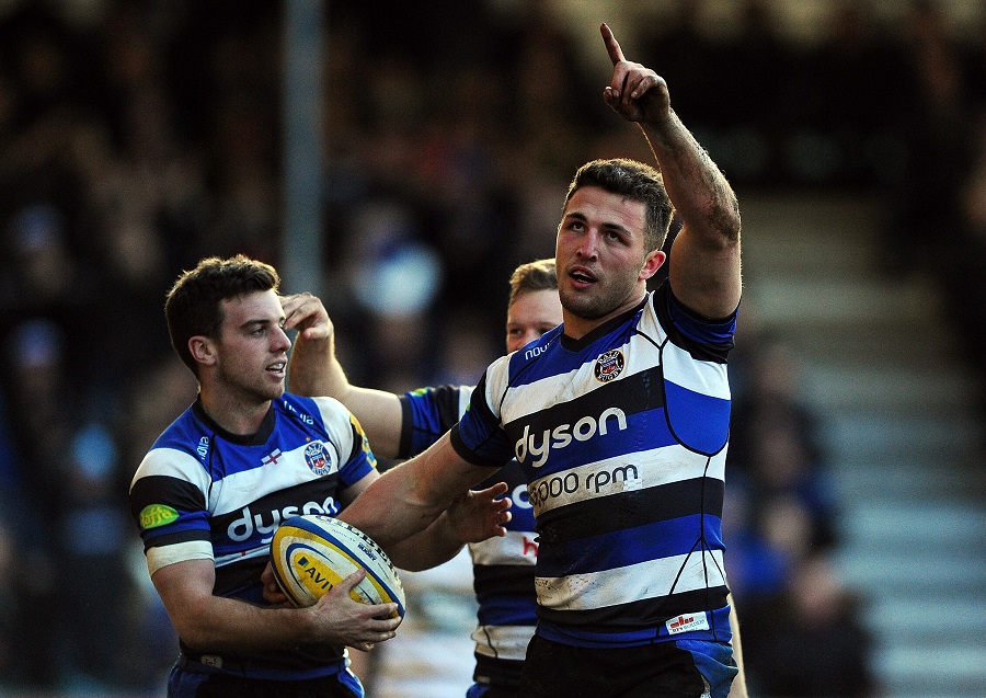 Sam Burgess points to the sky after scoring his first try for Bath 