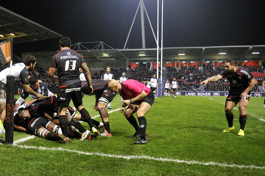 Amid a stack of bodies and much confusion, Thierry Dusautoir scores for Toulouse