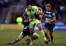 Northampton's Luther Burrell tries to escape the clutches of the Sale defence