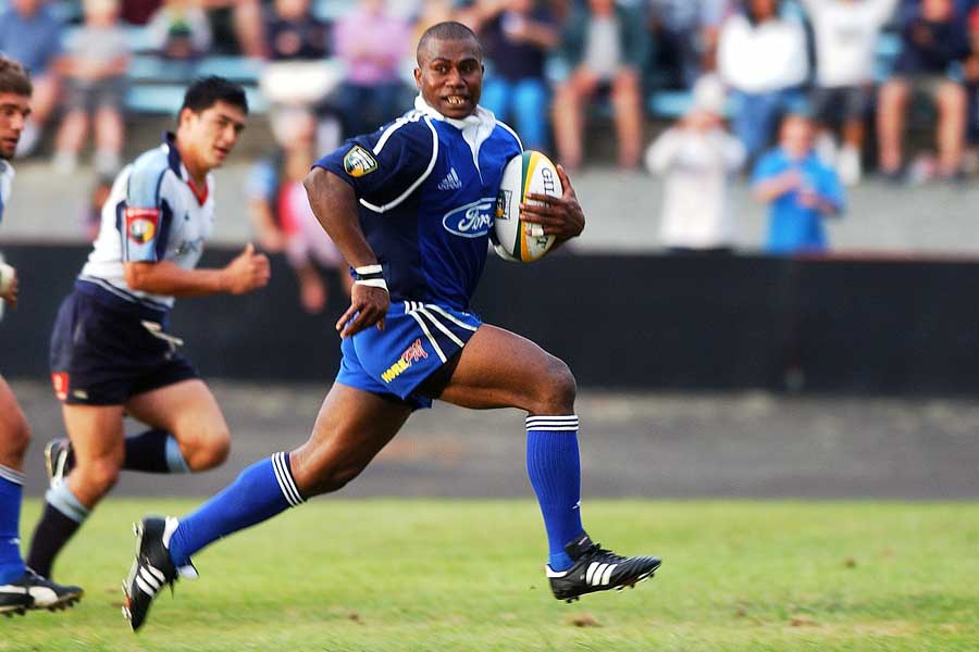 The Blues ' Rupeni Caucaunibuca breaks away for a try
