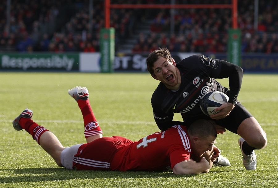 Alex Goode is tackled by Munster's Andrew Conway