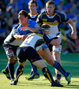 Western Force's Dane Haylett-Petty is tackled by Brumbies' David Pocock