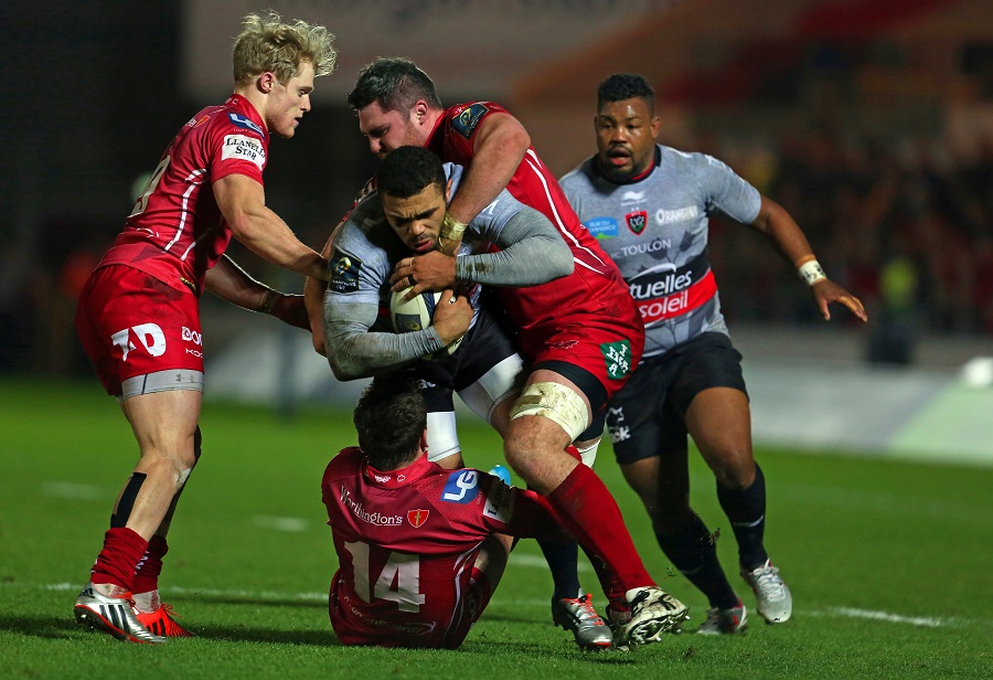 Toulon's Bryan Habana is tackled by three Scarlets