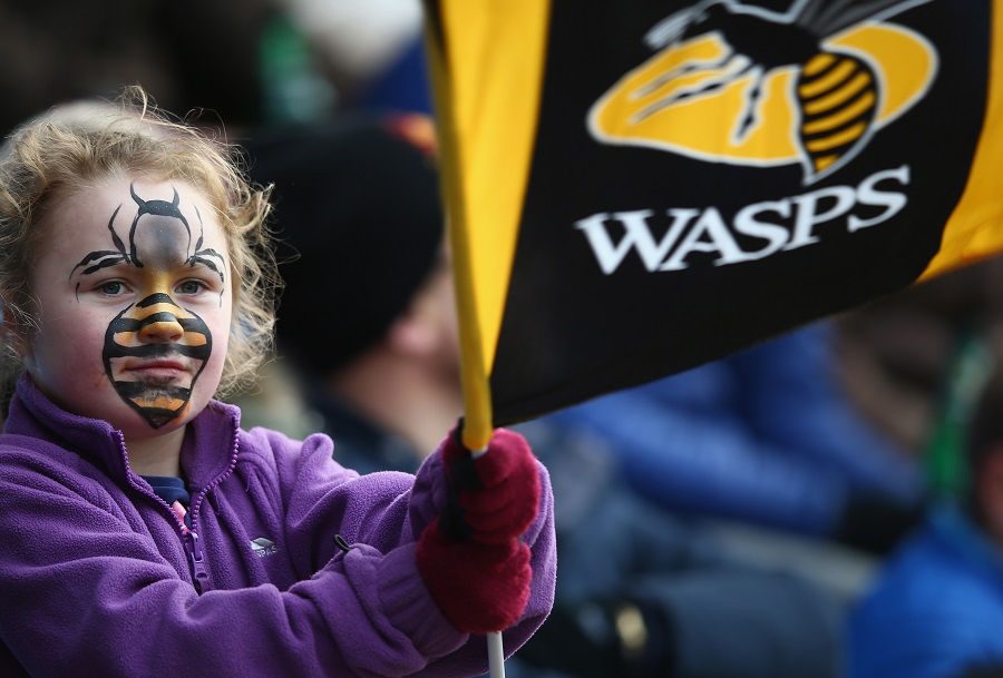 A young Wasps fan cheers her team on at the Ricoh Arena