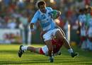 Santiago Gomez Cora is tackled by the Wales defence