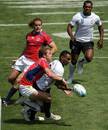 Vereniki Gonena of Fiji is tackled by the USA defence