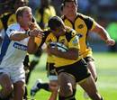 The Hurricanes' Willie Ripia shrugs off the tackle of the Cheetahs' Sarel Pretorius
