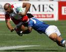 England's Tom Varndell is tackled by Samoa's Jerry Meafou