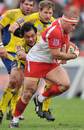 Biarritz's Fabien Barcella is tackled by Clermont's John Senio 