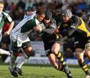 London Irish's Steffon Armitage is tackled by London Wasps' Danny Cipriani