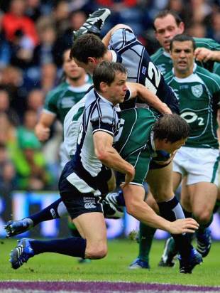 Scotland's Chris Paterson and Andrew Henderson tackle Ireland's Brian O'Driscoll, Scotland v Ireland, Rugby World Cup warm-up clash, Murrayfield, Edinburgh, Scotland, August 11, 2007