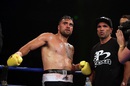 Liam Messam waits with Anthony Mundine for the result of his first boxing bout