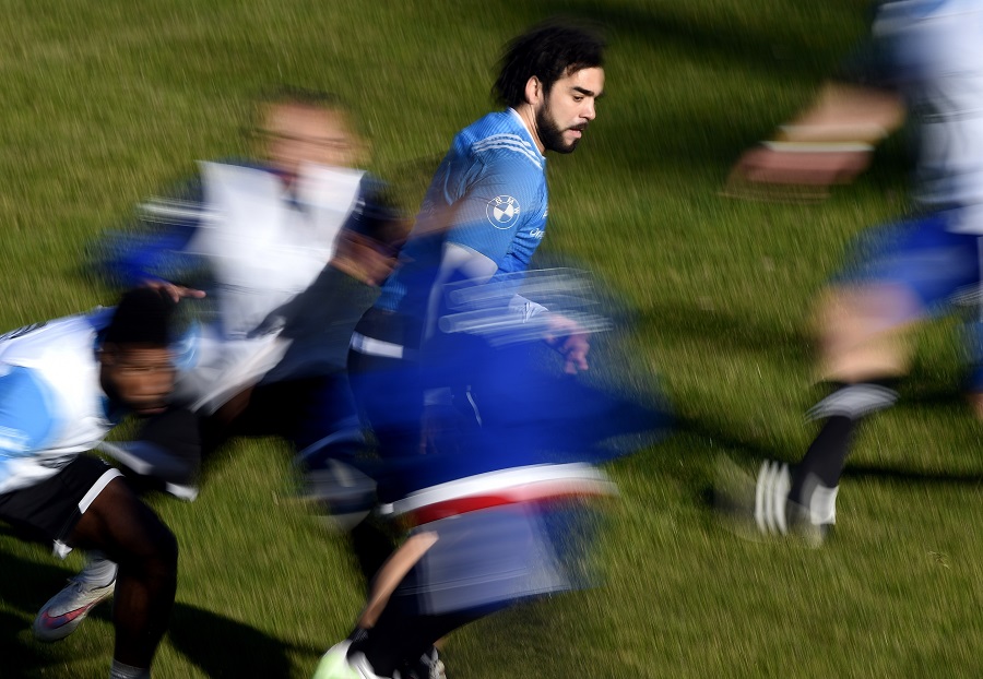 Toulouse winger Yoann Huget amid a blur of French team-mates