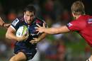 Melbourne Rebels' Mike Harris carts the ball forwards
