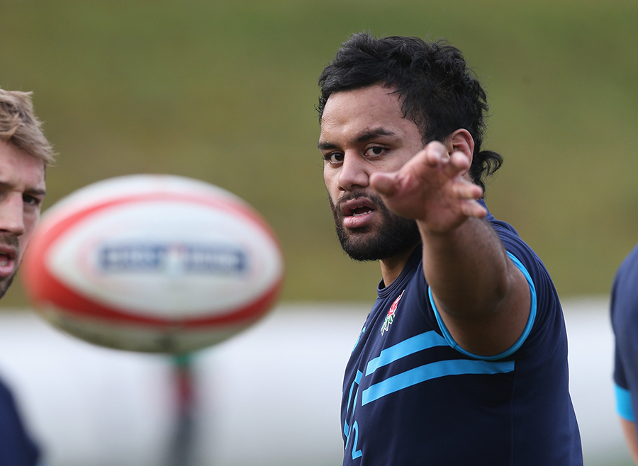 Billy Vunipola passes the ball during England's training session held