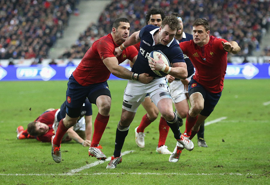 Stuart Hogg attempts to reach the try line for Scotland