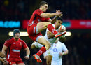 George North contests a high ball with England's Anthony Watson