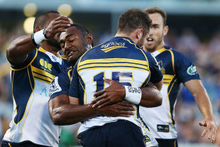 Brumbies fullback Robbie Coleman is congratulated by his team-mates, Brumbies v Reds, Canberra, February 13, 2015