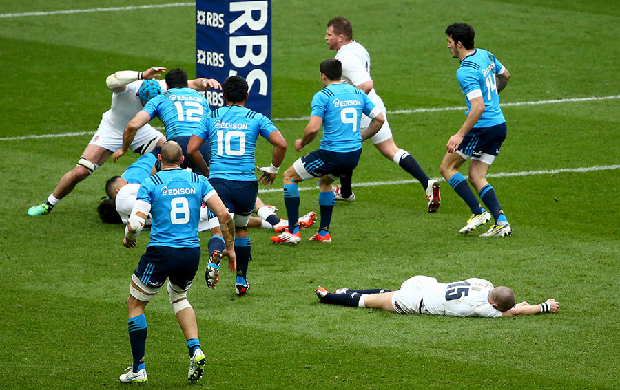England fullback Mike Brown is left flat out after a collision