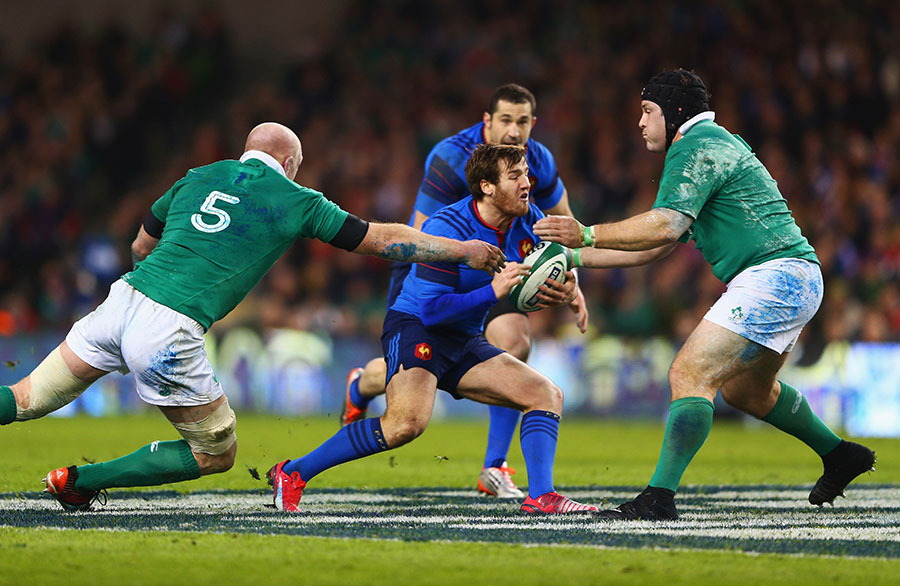 Camille Lopez of France is tackled by Ireland's Paul O'Connell and Mike Ross