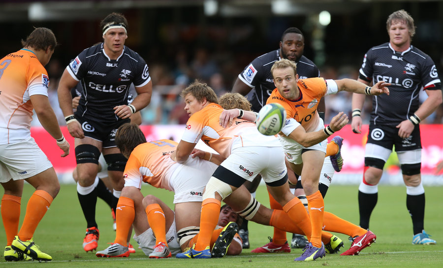 Cheetahs' half-back Sarel Pretorius passes the ball from behind the ruck 
