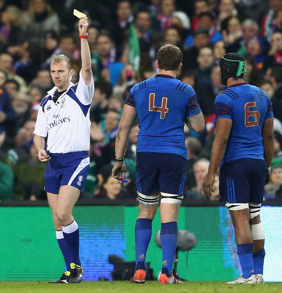 France's Pascal Pape is issued a yellow card