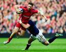 Wales' Alex Cuthbert tries to break through the Scotland defence