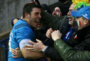 Edoardo Gori celebrates with Italy fans after full time