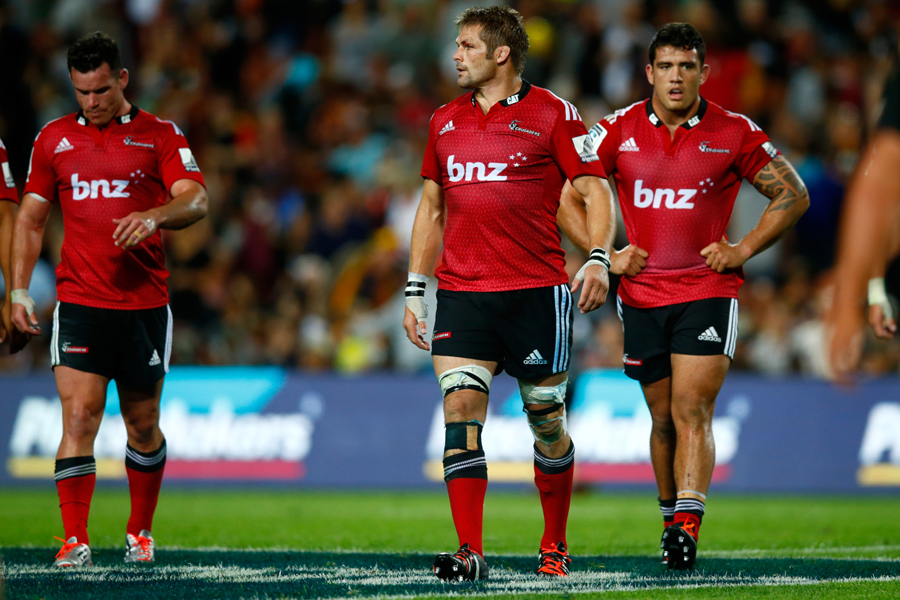The Crusaders' Richie McCaw leads the team off the pitch