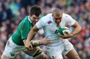 Jonathan Joseph is tackled by Peter O'Mahoney