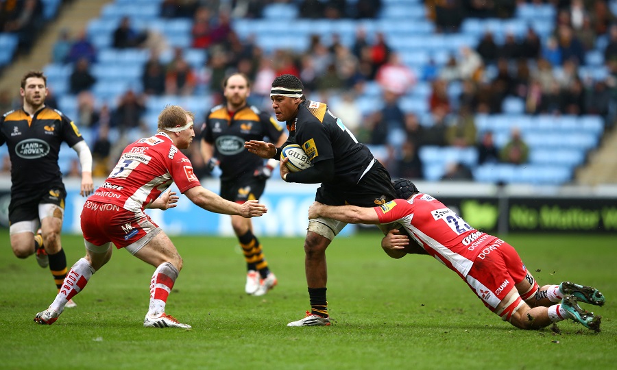 Nathan Hughes is tackled by Gloucester defenders