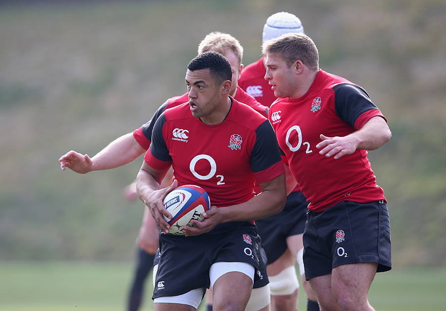 Luther Burrell runs with the ball during England training