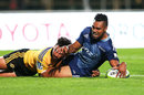 Lolagi Visinia of the Blues crashes over to score a try