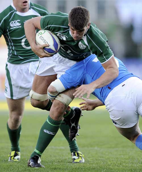 Ireland's Donncha O'Callaghan is tackled by Italy's Carlos Nieto