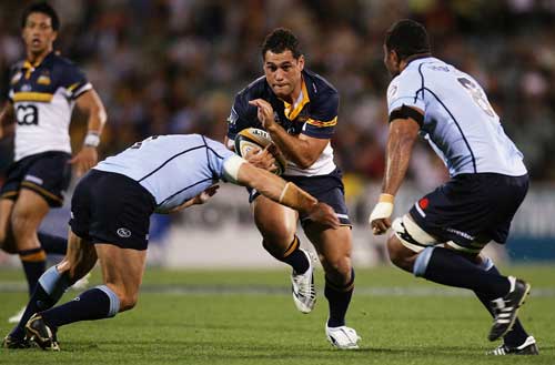Brumbies flanker George Smith takes on the Waratahs defence