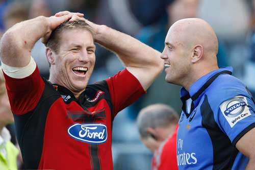 The Crusaders' Brad Thorn talks with Western Force's Nathan Sharpe
