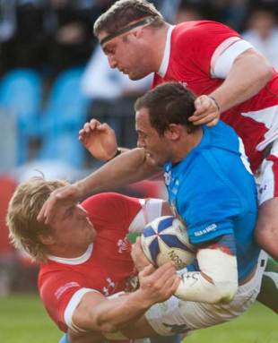 Italy skipper Sergio Parisse is tackled by Andy Powell and Rhys Thomas, Italy v Wales, Six Nations Championship, Stadio Flaminio, Rome, Italy, March 14, 2009