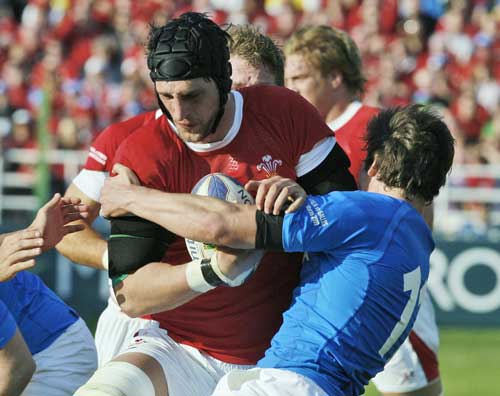 Wales lock Luke Charteris crashes in to the Italian defence