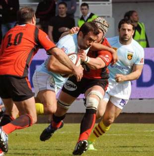 Perpignan's centre David Marty vies with Toulon's Sebastien Fauque during their Top 14 French rugby union match