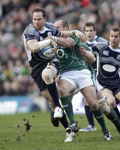 Scotland's Graeme Morrison is tackled by Ireland's Rory Best 