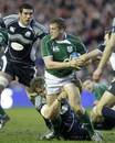 Ireland's Jamie Heaslip is tackled by Scotland's Jason White