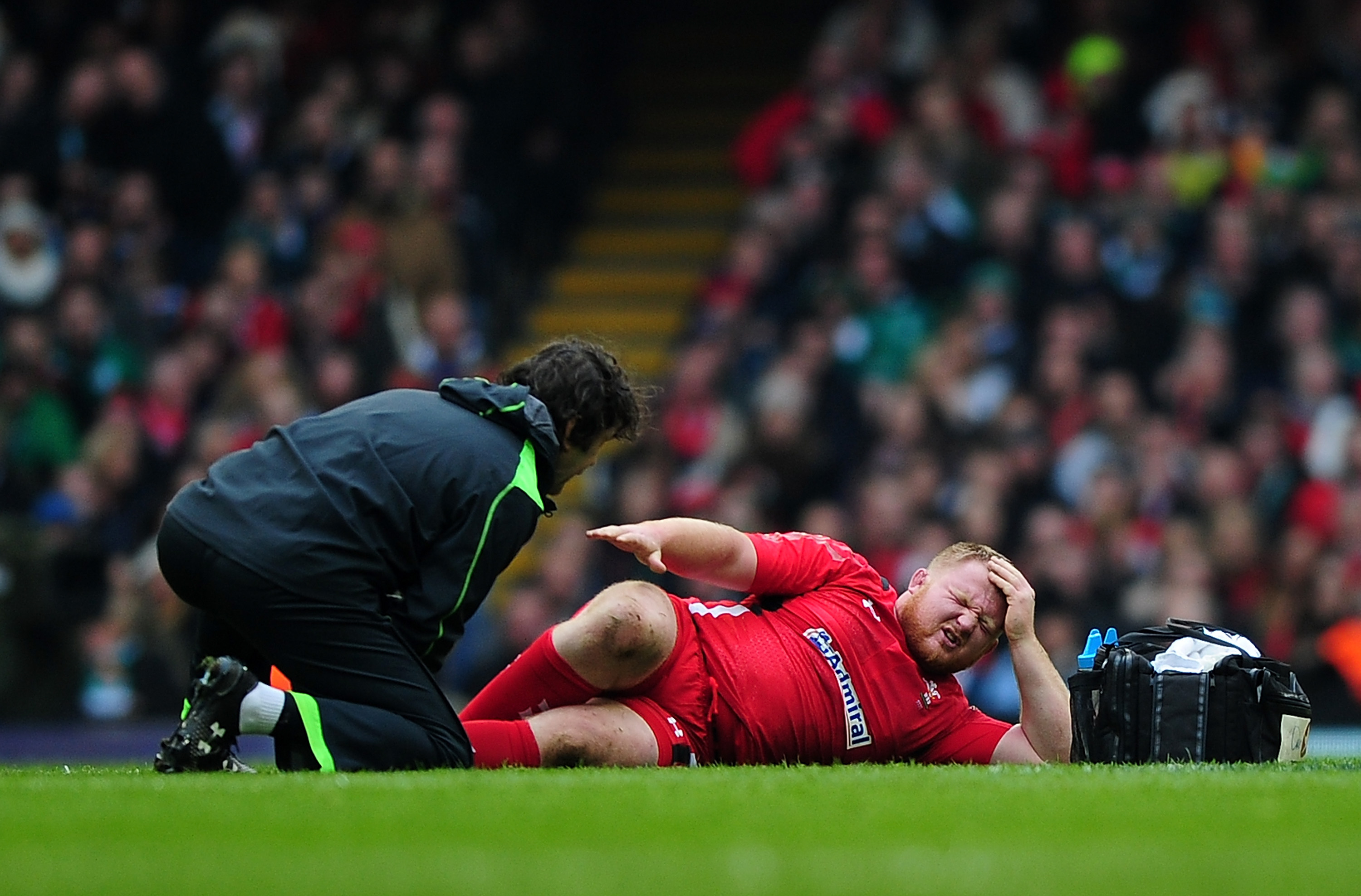 Samson Lee is treated for a leg injury