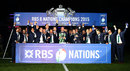Paul O'Connell is presented with the new Six Nations trophy as the Ireland team celebrates