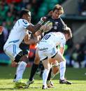 Saracens' Marcelo Bosch is wrapped up by Exeter