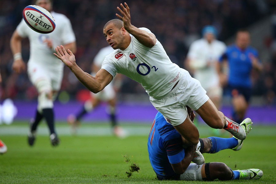 Jonathan Joseph offloads the ball while being tackled by Noa Nakaitaci