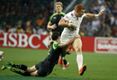 England's James Rodwell, right, is tackled by Tomos Williams of Wales
