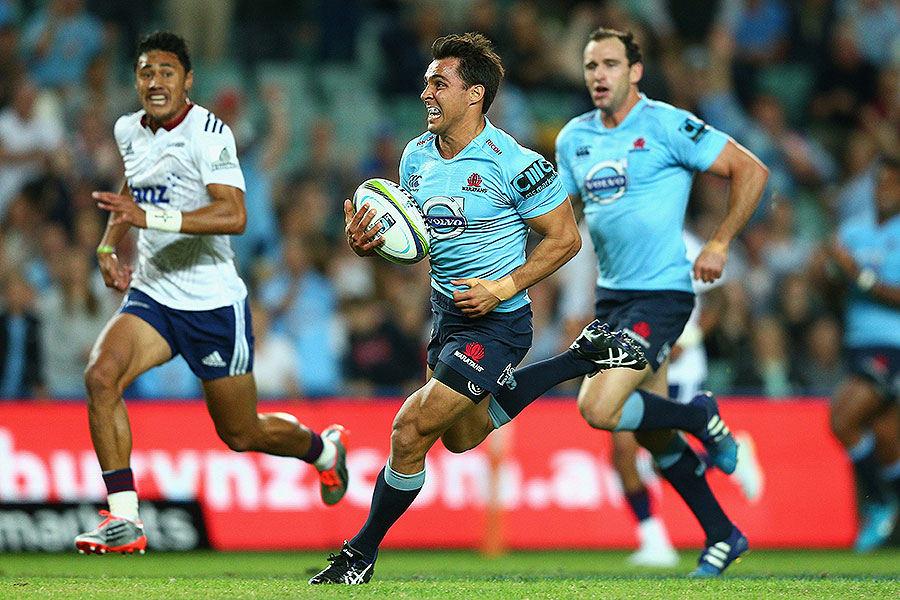 The Waratahs' Nick Phipps runs in for a try